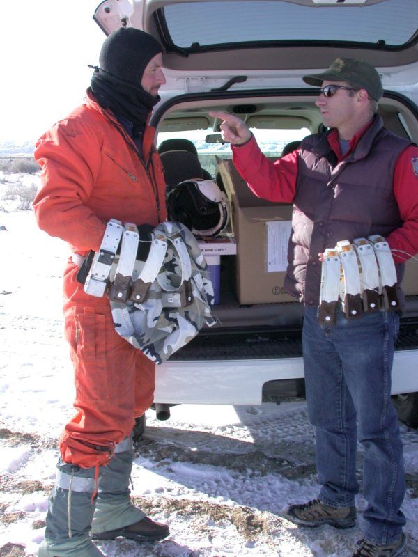 Hall Sawyer (left) and Tim Woolley (right; WGFD) discuss capture logistics. The mule deer research relied on fine-scale movement data that was collected from GPS collars. Capture efforts were coordinated with Wyoming Game and Fish Department each winter.